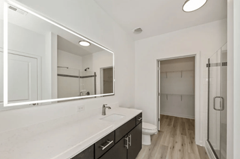 Led backlit mirrors in bathrooms in select homes